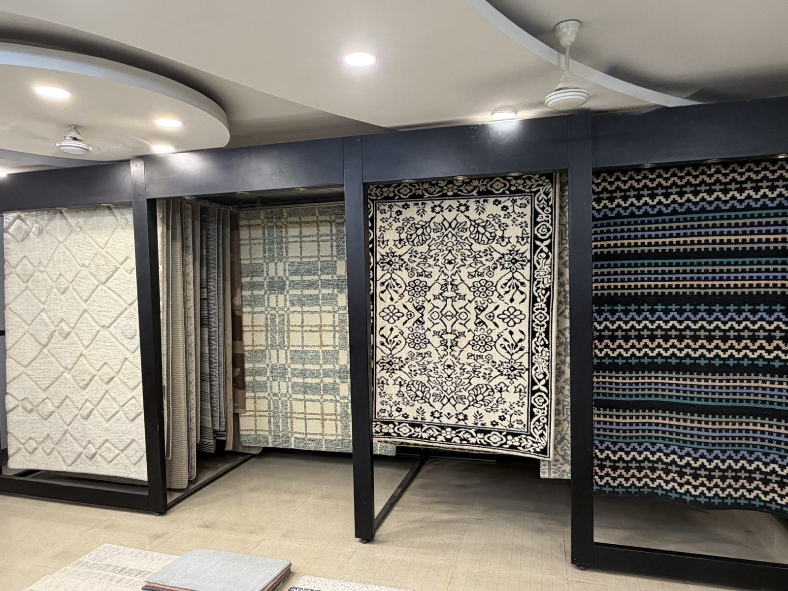 Warp Street showroom displaying hand-knotted and woven rug designs